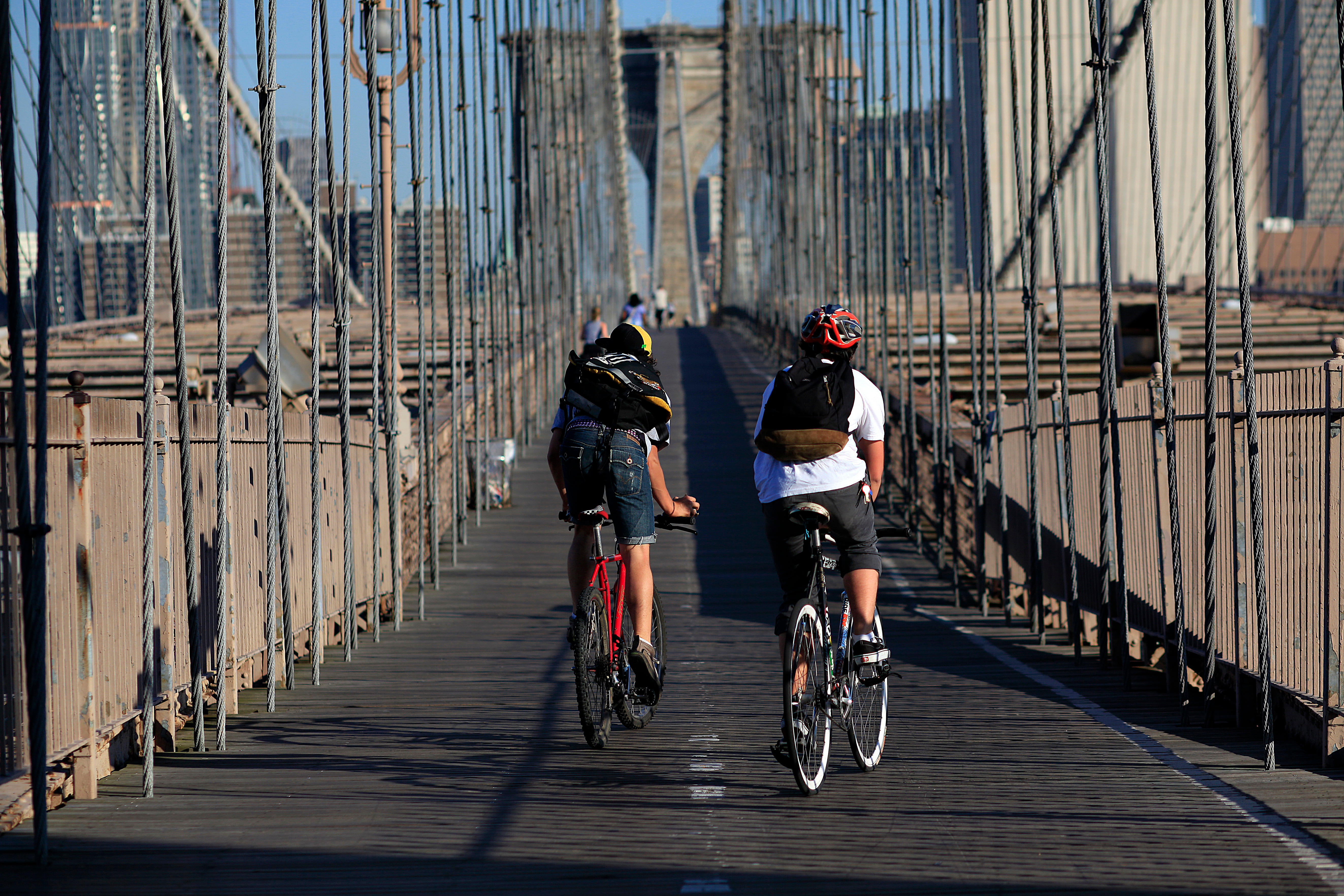 Cyclists cross a bridge in NYC.